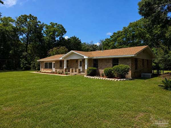1.5 Acres of Land with Home for Sale in Milton, Florida
