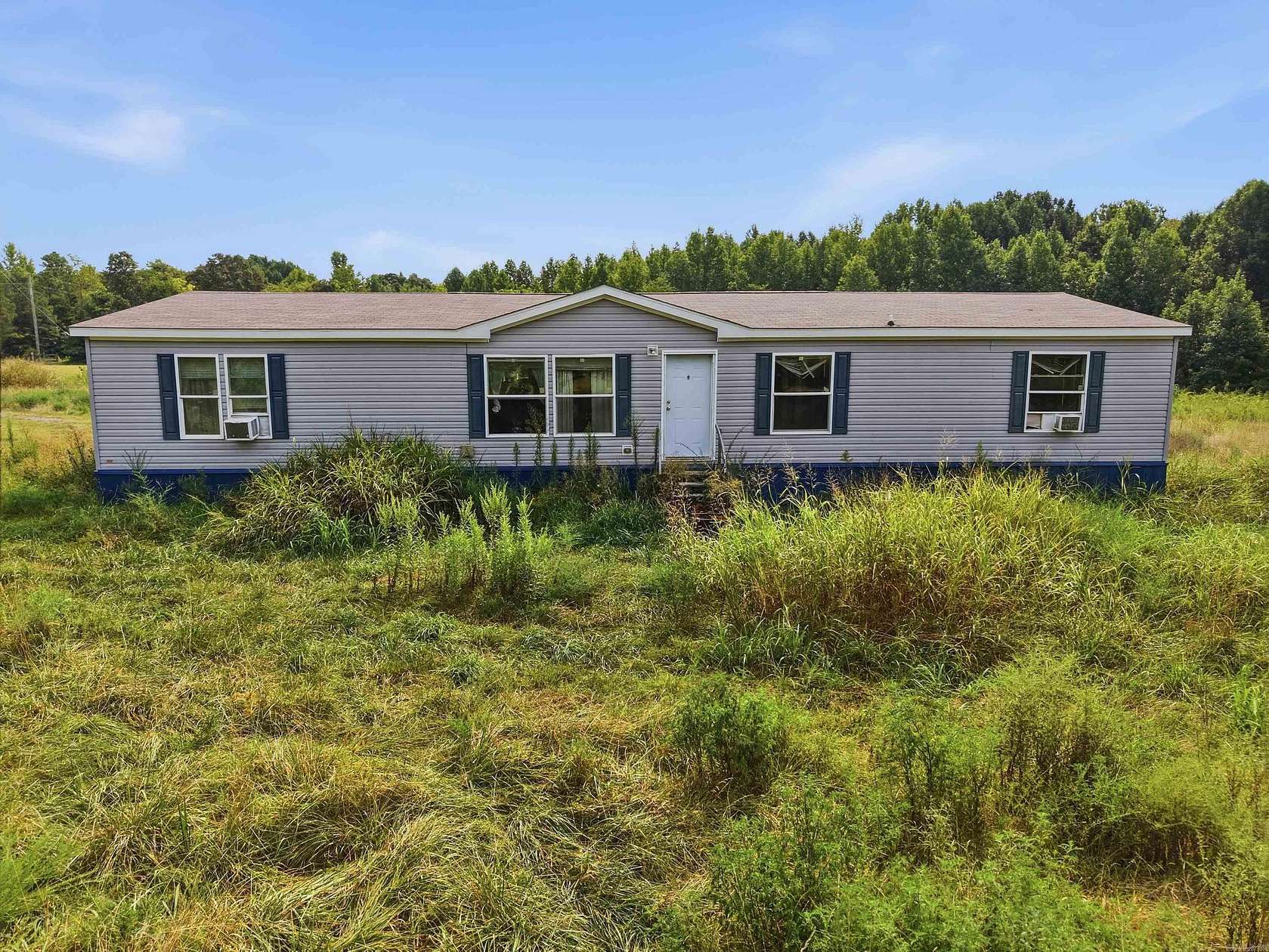 5 Acres of Land with Home for Sale in Romance, Arkansas