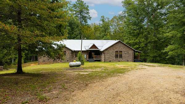 6.52 Acres of Land with Home for Sale in Stephens, Arkansas