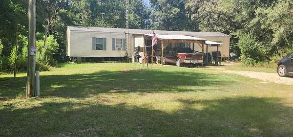 19.6 Acres of Land with Home for Sale in Poplarville, Mississippi