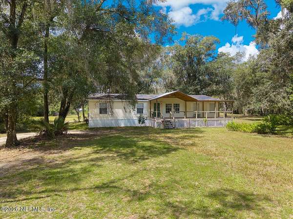 2.66 Acres of Land with Home for Sale in Interlachen, Florida