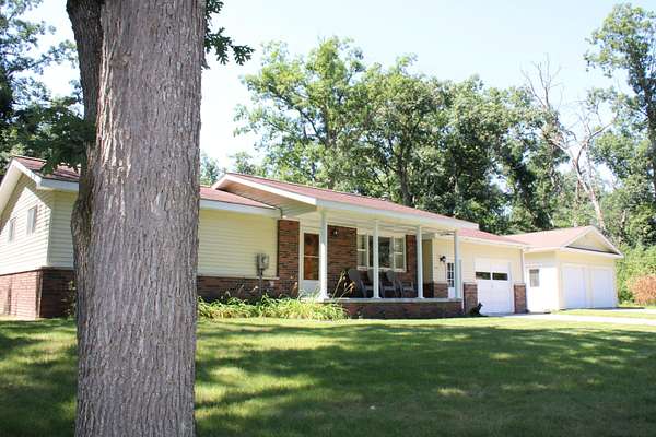0.94 Acres of Land with Home for Sale in Comins, Michigan