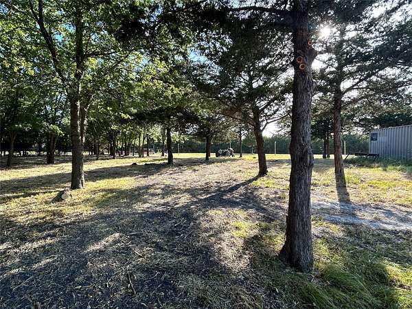 28.3 Acres of Land with Home for Sale in Wolfe City, Texas