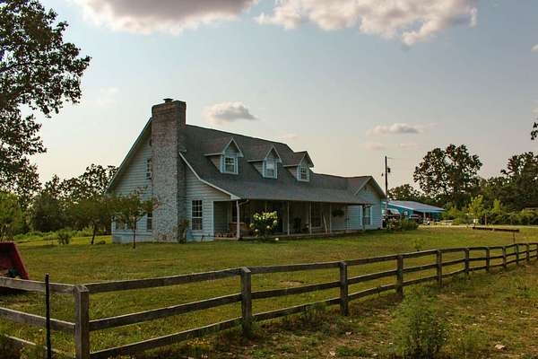 26.7 Acres of Agricultural Land with Home for Sale in Koshkonong, Missouri