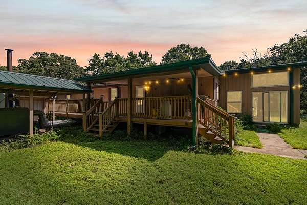 40 Acres of Agricultural Land with Home for Sale in Humansville, Missouri