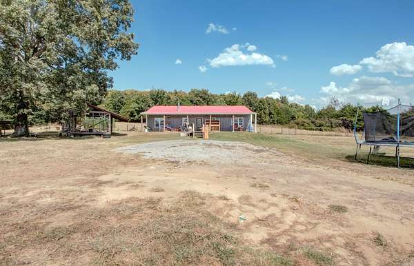 10 Acres of Land with Home for Sale in Romance, Arkansas