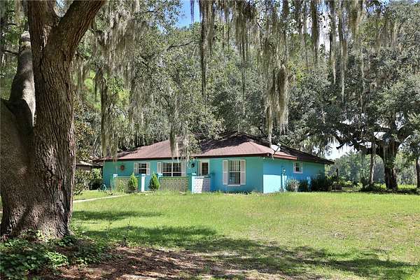 5.56 Acres of Land with Home for Sale in Reddick, Florida