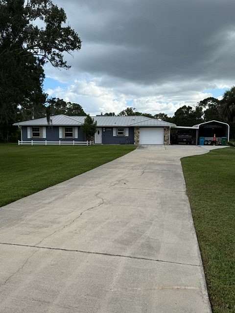 2.5 Acres of Land with Home for Sale in Grant-Valkaria, Florida