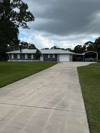 2.5 Acres of Land with Home for Sale in Grant-Valkaria, Florida