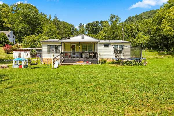 6.6 Acres of Land with Home for Sale in Elmwood, Tennessee
