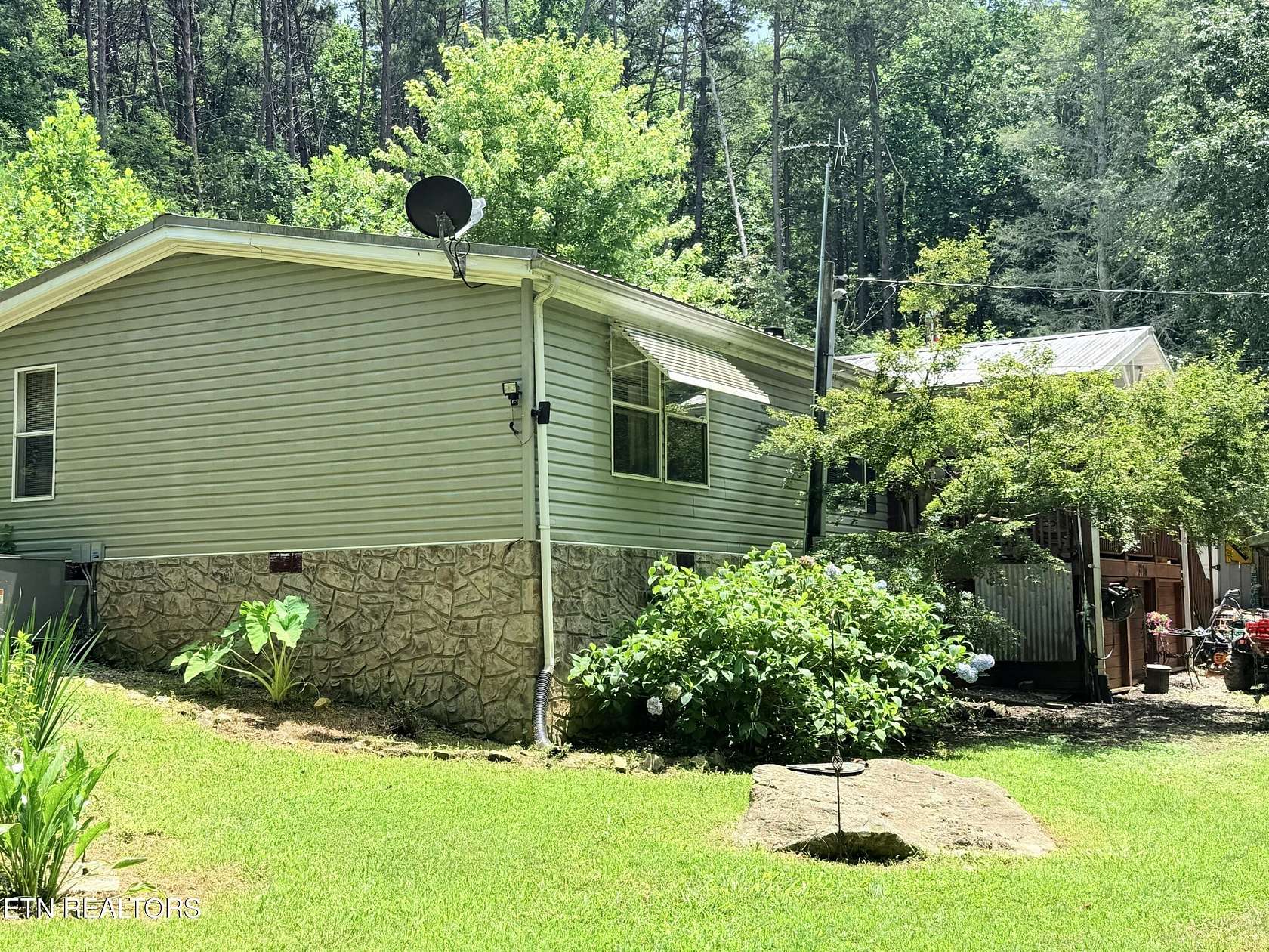 2.28 Acres of Land with Home for Auction in Sevierville, Tennessee
