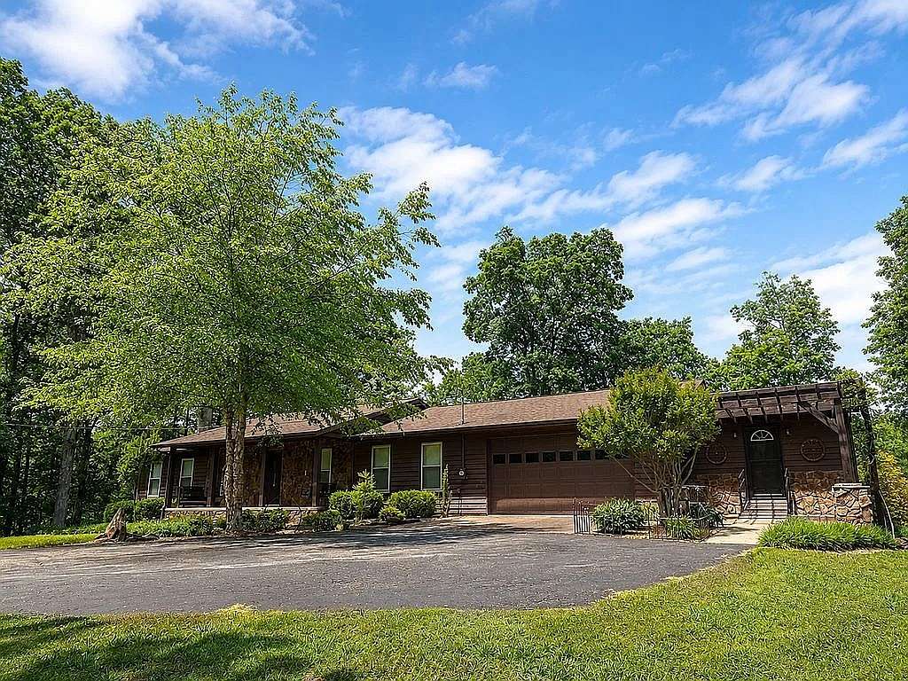 12.4 Acres of Recreational Land with Home for Sale in Paris, Tennessee