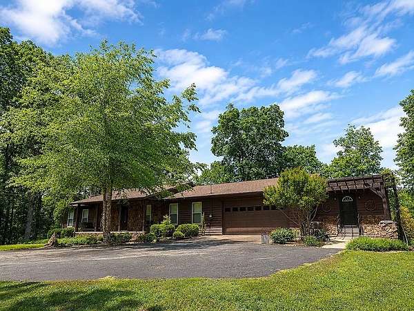 12.4 Acres of Recreational Land with Home for Sale in Paris, Tennessee