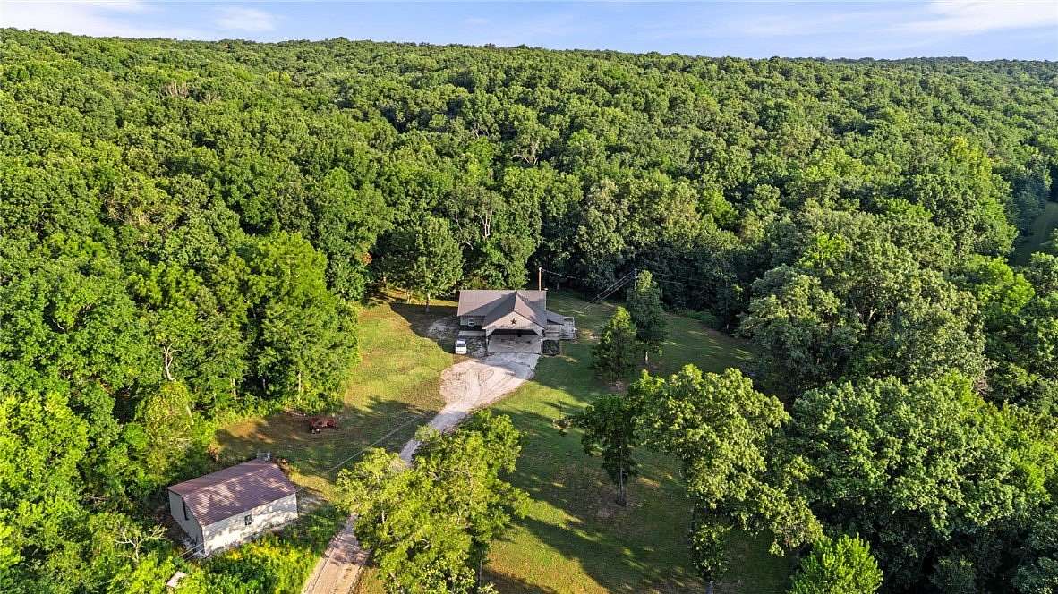 204 Acres of Land with Home for Sale in Goodman, Missouri