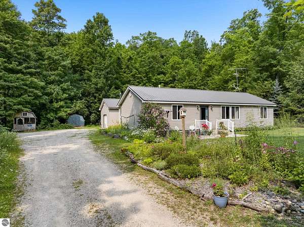 3.25 Acres of Land with Home for Sale in Cedar, Michigan