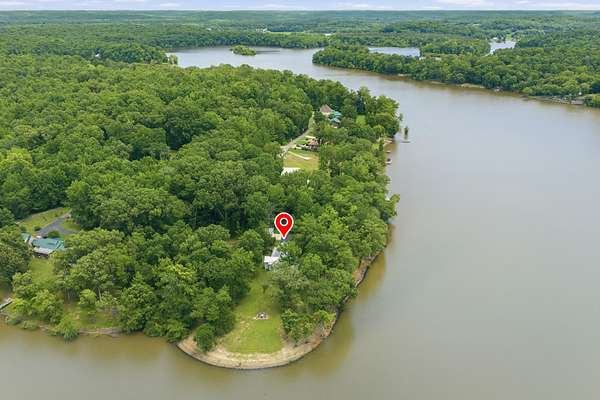 6.86 Acres of Land with Home for Sale in Parsons, Tennessee