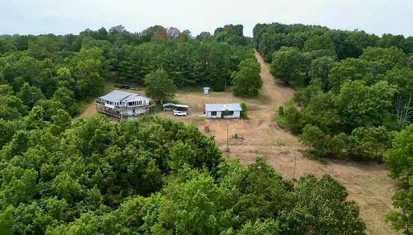 195 Acres of Land with Home for Sale in Pineville, Missouri