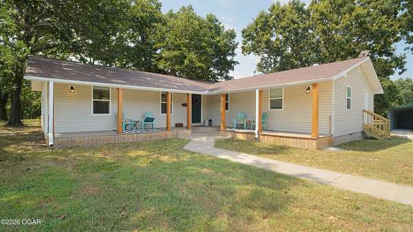 6.85 Acres of Land with Home for Sale in Carthage, Missouri