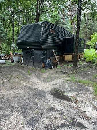 0.5 Acres of Land for Sale in Prudenville, Michigan