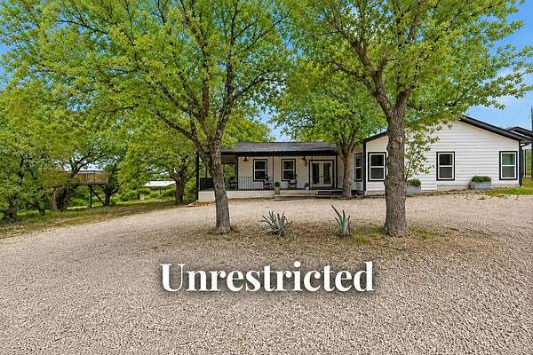 7.79 Acres of Land with Home for Sale in Johnson City, Texas