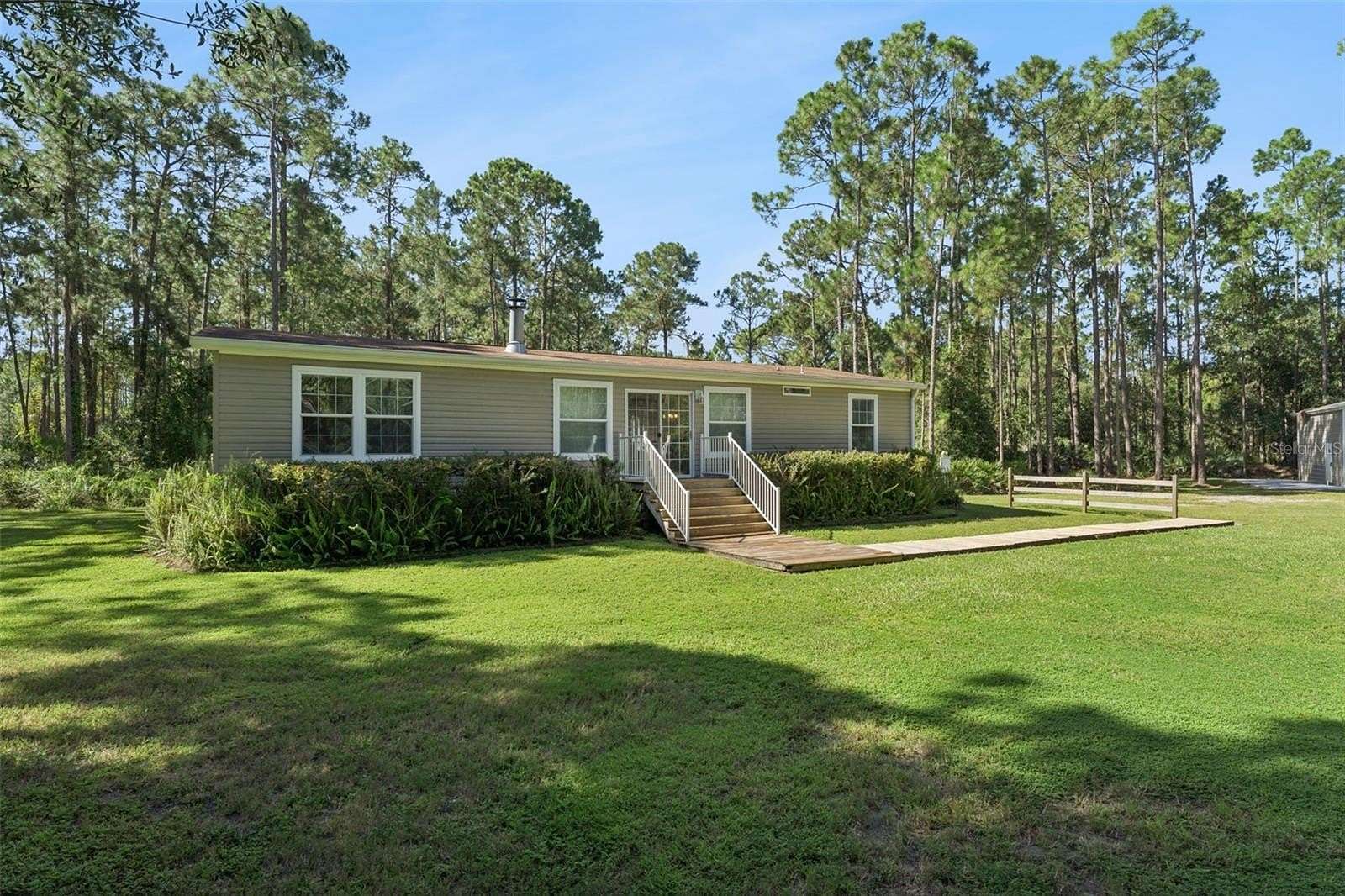 4.65 Acres of Land with Home for Sale in Mims, Florida