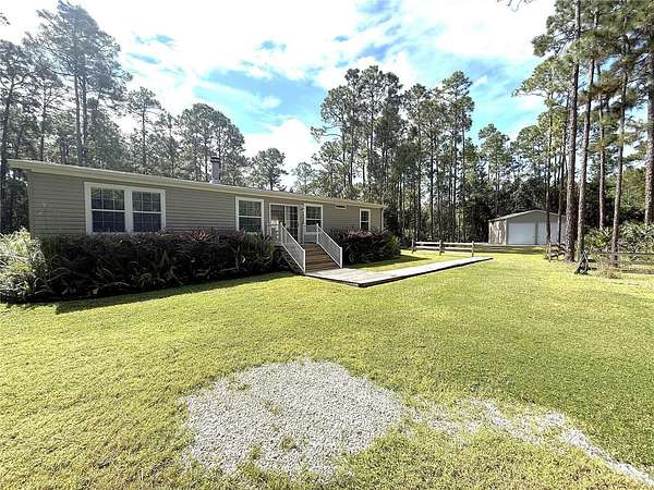 4.65 Acres of Land with Home for Sale in Mims, Florida