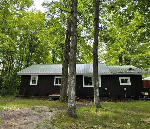 20 Acres of Recreational Land with Home for Sale in Onaway, Michigan