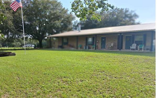 13.4 Acres of Land with Home for Auction in McAlpin, Florida