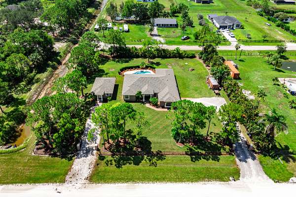 1.56 Acres of Land with Home for Sale in The Acreage, Florida