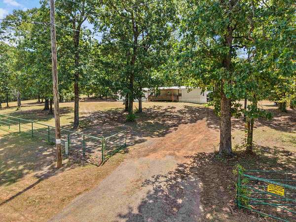 4.38 Acres of Land with Home for Sale in Lone Star, Texas