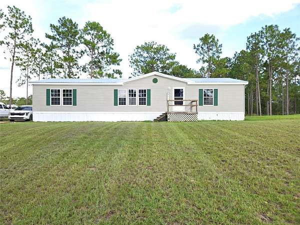 2.79 Acres of Land with Home for Sale in Morriston, Florida