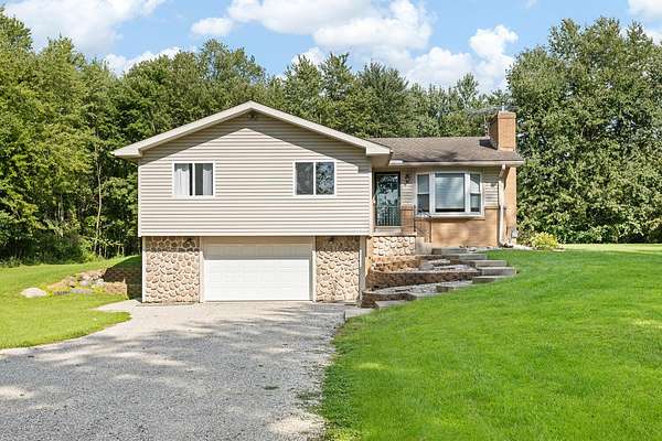 2 Acres of Land with Home for Sale in Sand Creek, Michigan