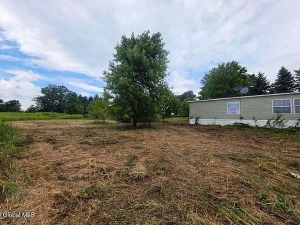 6.75 Acres of Land with Home for Auction in Cobleskill, New York