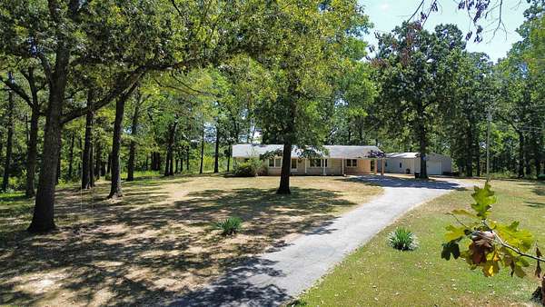 87 Acres of Land with Home for Sale in Ash Flat, Arkansas