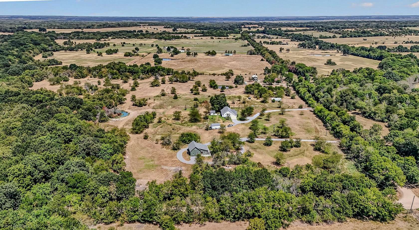5 Acres of Land with Home for Sale in Wolfe City, Texas