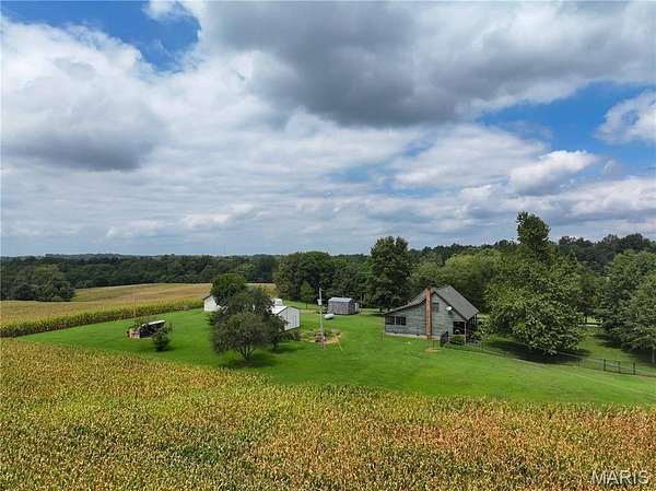 102 Acres of Land with Home for Sale in Jackson, Missouri