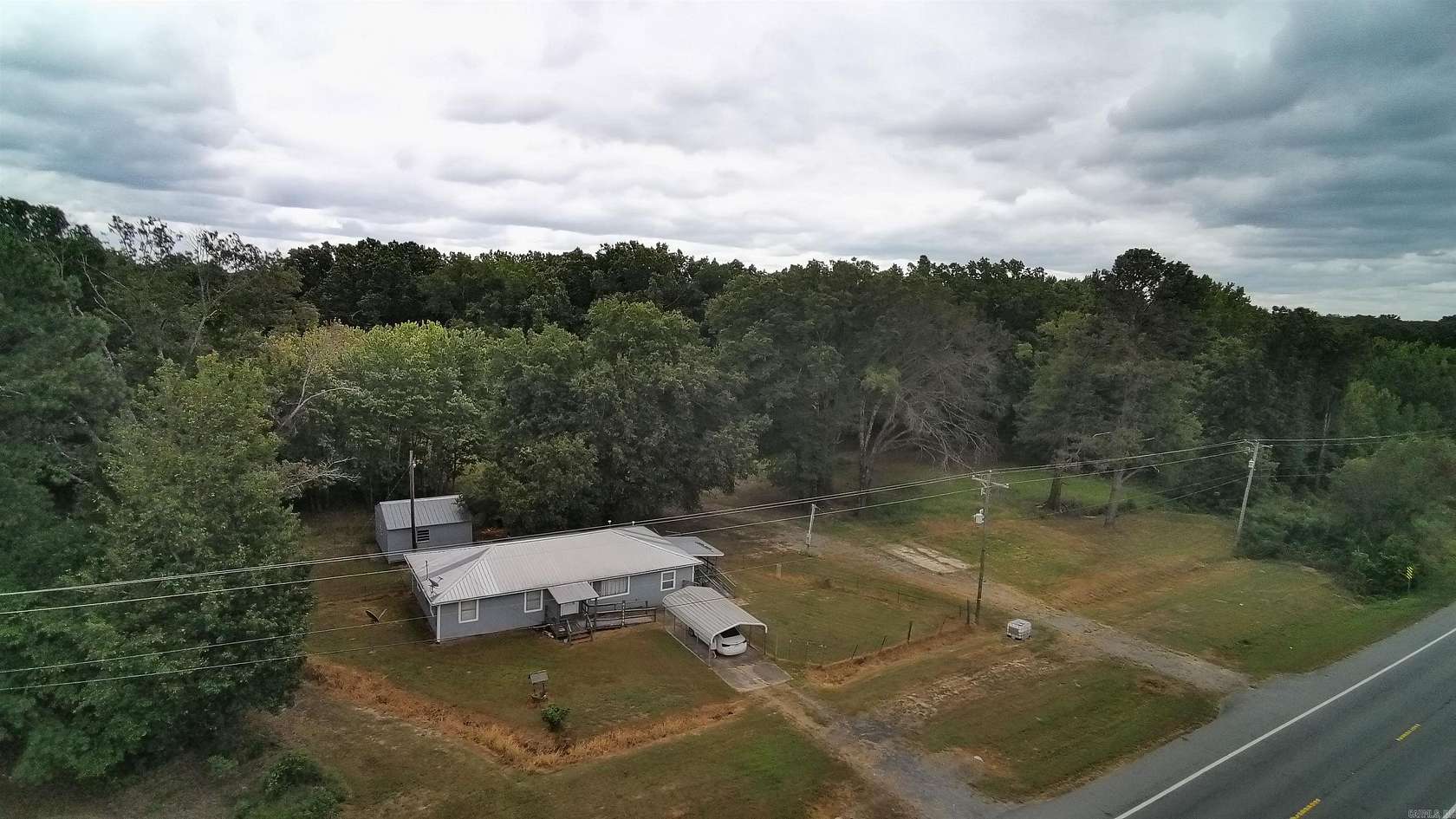 1.5 Acres of Land with Home for Sale in De Valls Bluff, Arkansas