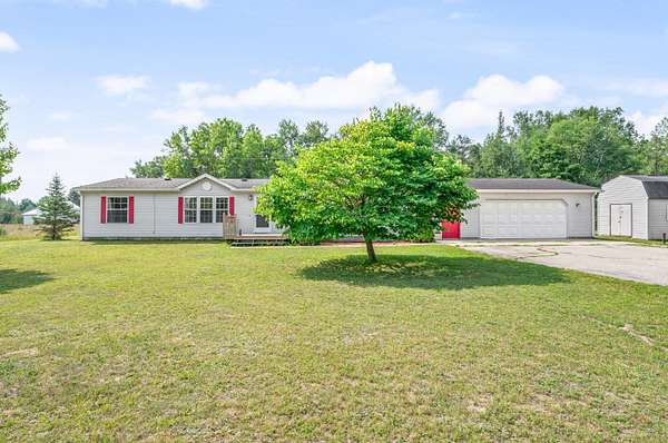 1.5 Acres of Land with Home for Sale in Evart, Michigan