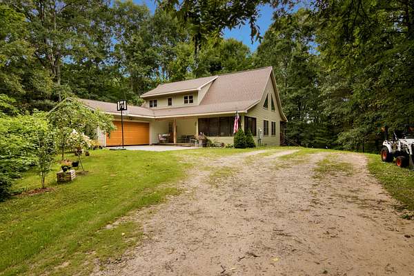 41 Acres of Recreational Land with Home for Sale in Free Soil, Michigan