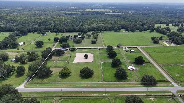 11.6 Acres of Land with Home for Sale in Reddick, Florida