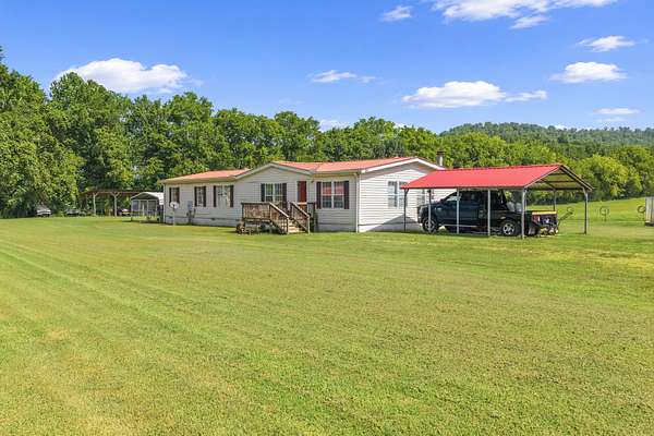 23.5 Acres of Agricultural Land with Home for Sale in Linden, Tennessee