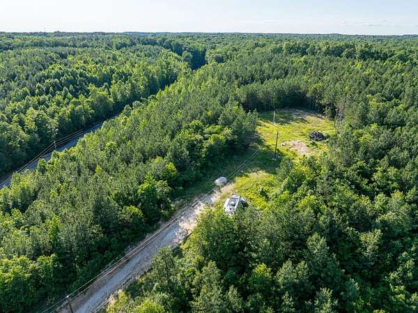 12.8 Acres of Land with Home for Auction in Holladay, Tennessee