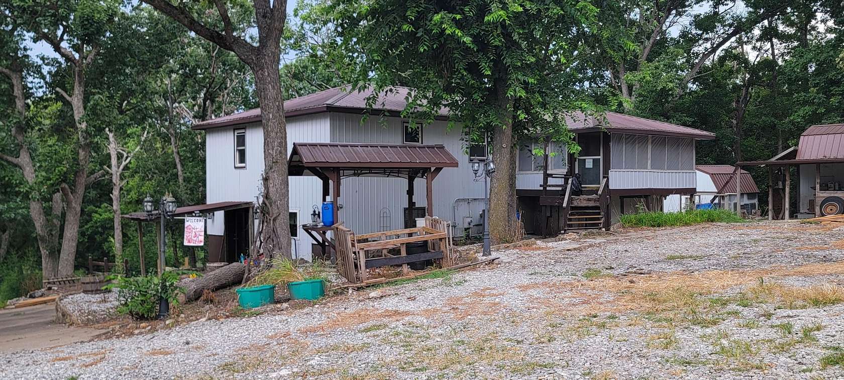 10 Acres of Land with Home for Sale in Hughesville, Missouri