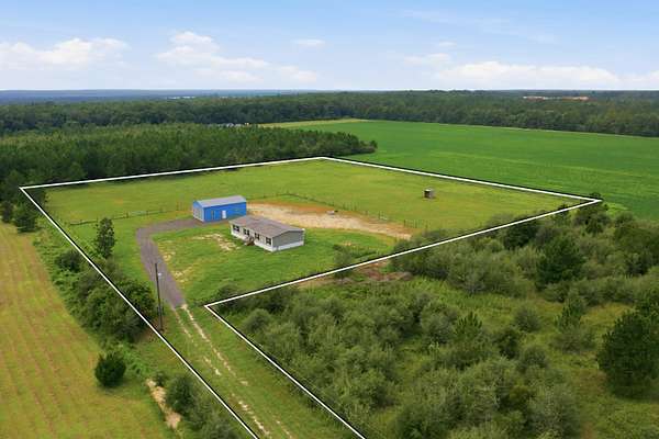 6.15 Acres of Land with Home for Sale in Holt, Florida