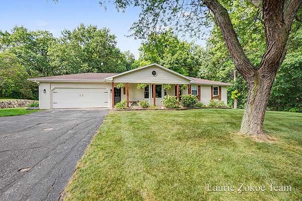 2 Acres of Land with Home for Sale in Coopersville, Michigan