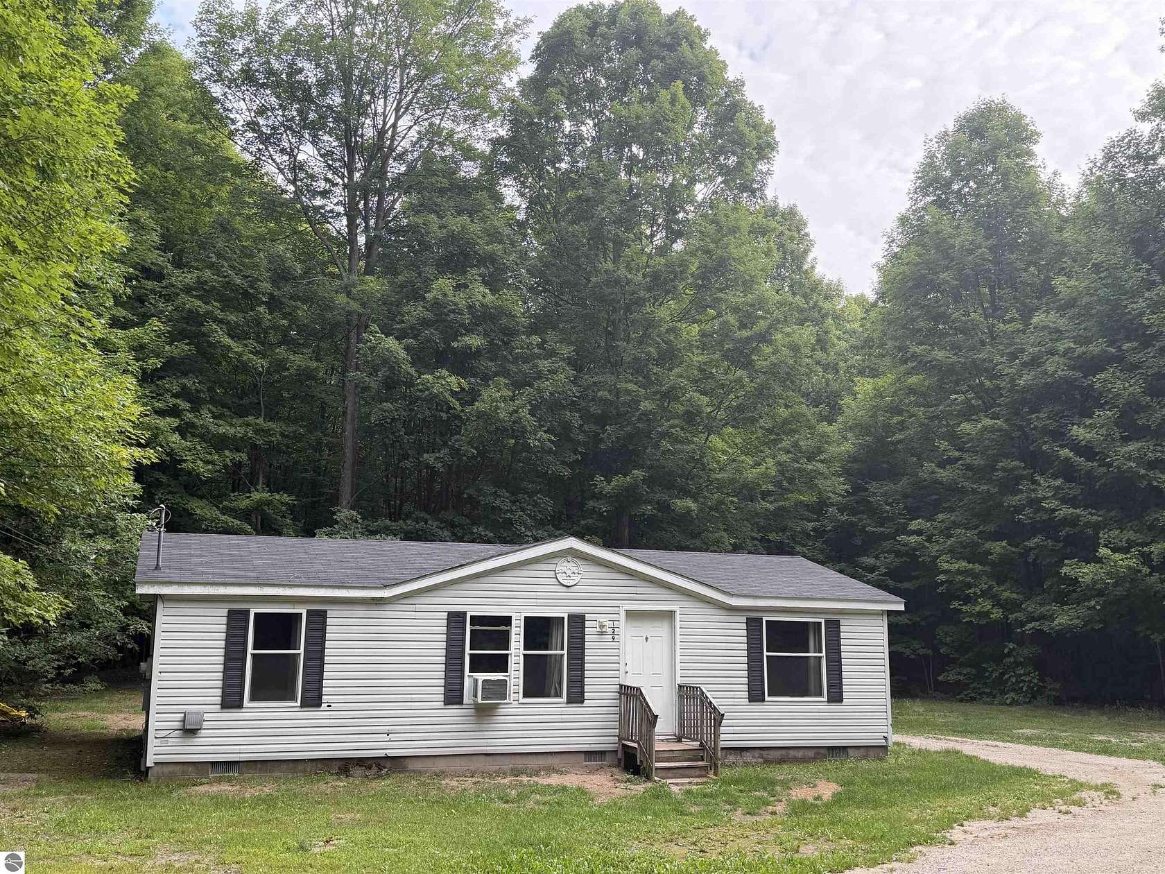 5 Acres of Land with Home for Sale in Beulah, Michigan