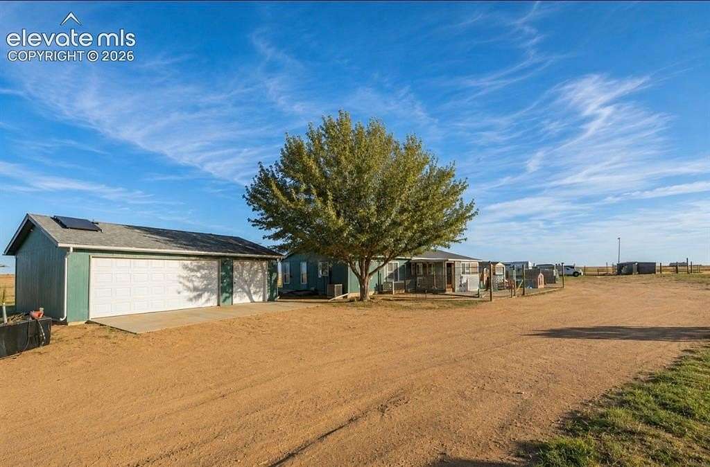 27 Acres of Agricultural Land with Home for Sale in Yoder, Colorado