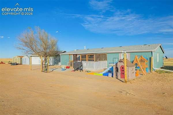 27 Acres of Agricultural Land with Home for Sale in Yoder, Colorado