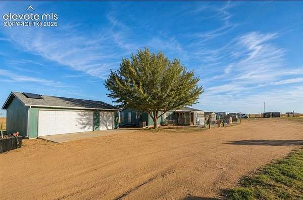 27 Acres of Agricultural Land with Home for Sale in Yoder, Colorado