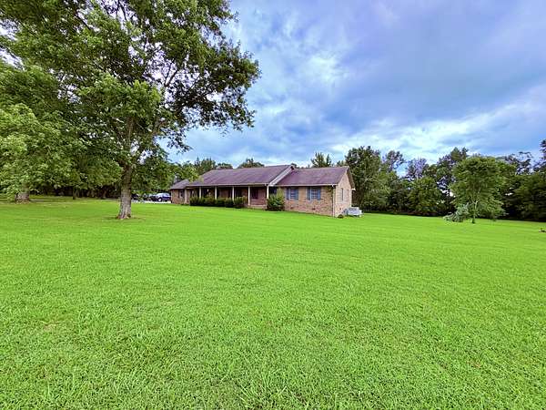 4.9 Acres of Land with Home for Sale in Puryear, Tennessee